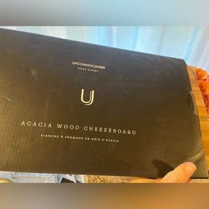 Common James Acacia wood cheeseboard